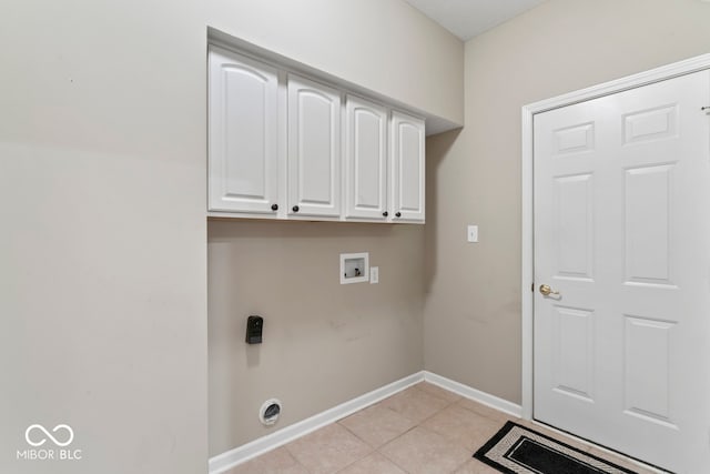 laundry room with hookup for a washing machine, light tile patterned flooring, electric dryer hookup, and cabinets