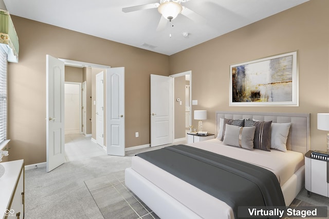 carpeted bedroom with ceiling fan