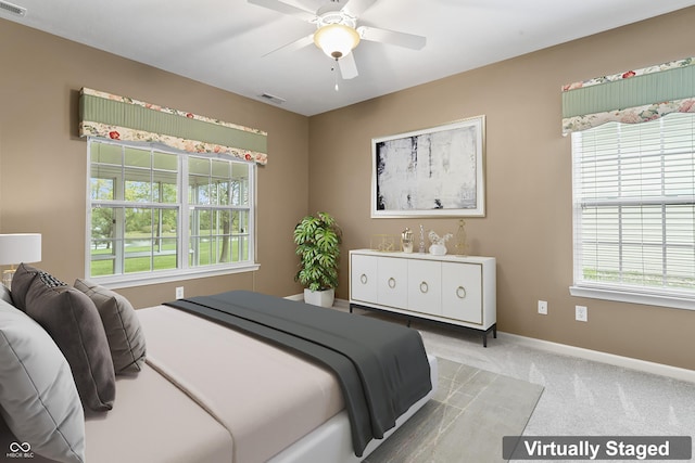 carpeted bedroom featuring ceiling fan