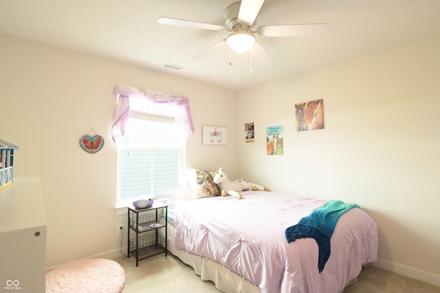 bedroom with ceiling fan and light colored carpet