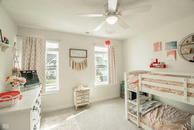 bedroom featuring ceiling fan and light colored carpet