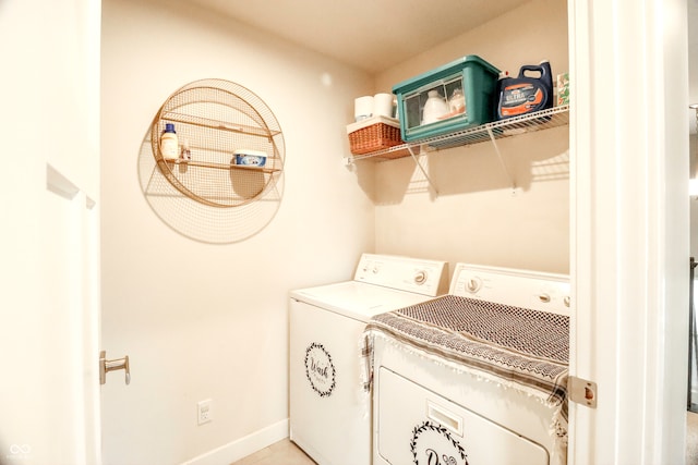 clothes washing area with washer and clothes dryer