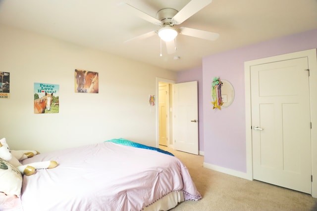 bedroom with light carpet and ceiling fan