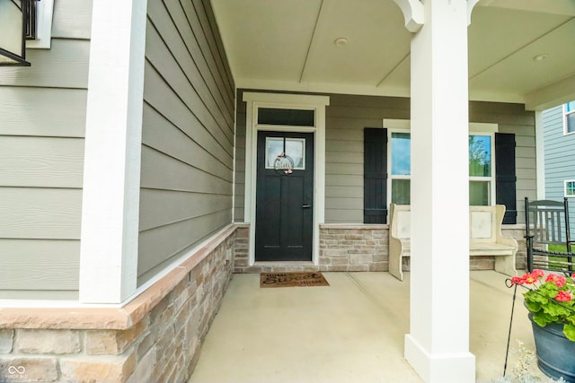 property entrance with covered porch