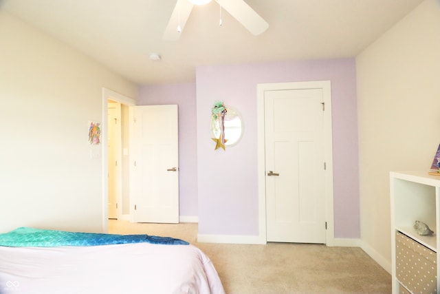 carpeted bedroom featuring ceiling fan