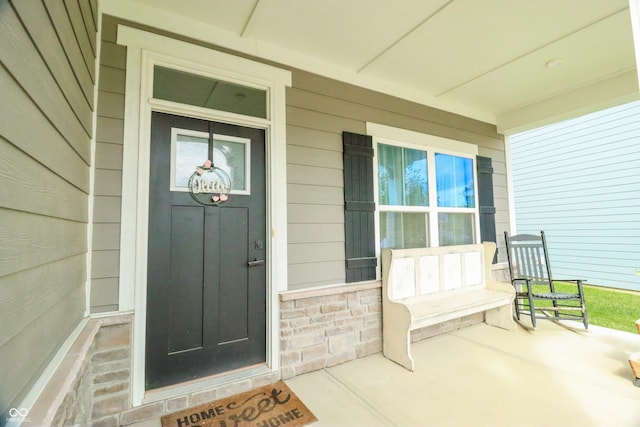 property entrance featuring covered porch