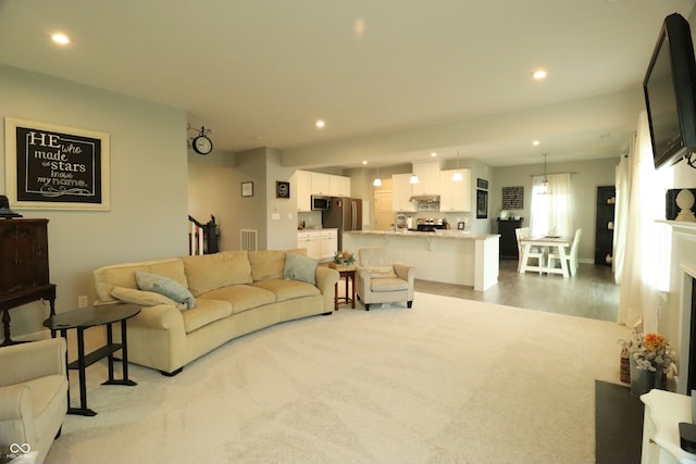 living room with light hardwood / wood-style flooring