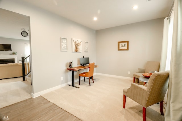 office space with light hardwood / wood-style floors