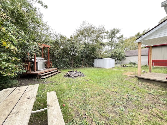 view of yard featuring a shed and a deck