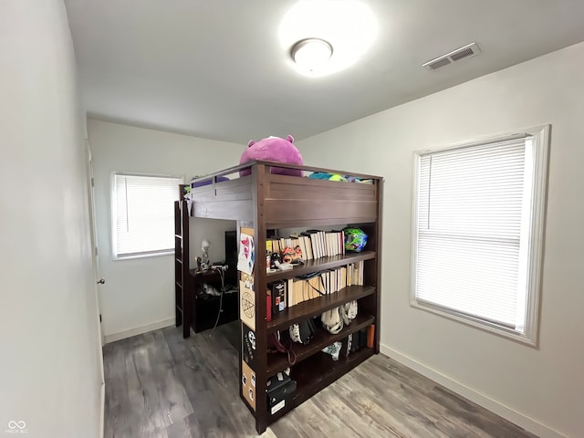 bedroom with hardwood / wood-style floors