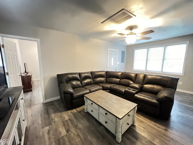 living room with dark hardwood / wood-style floors and ceiling fan