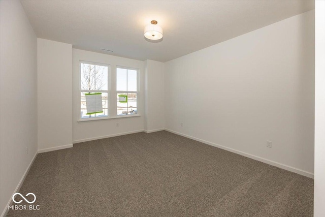 empty room featuring carpet flooring