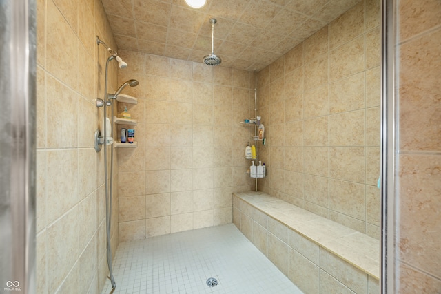 bathroom with tiled shower