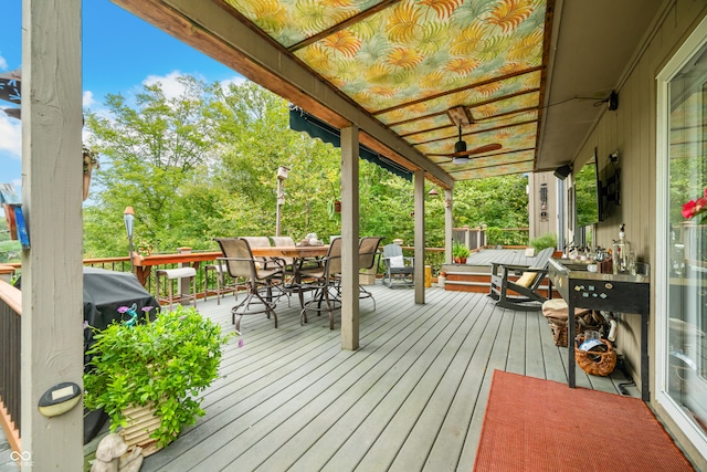 wooden terrace featuring ceiling fan