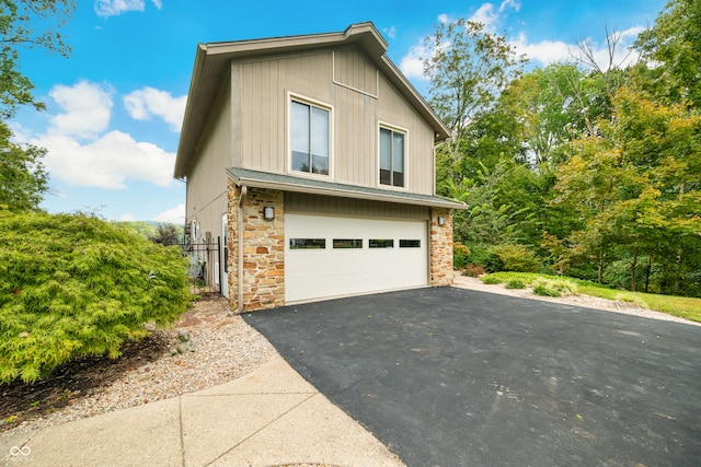 view of property exterior with a garage