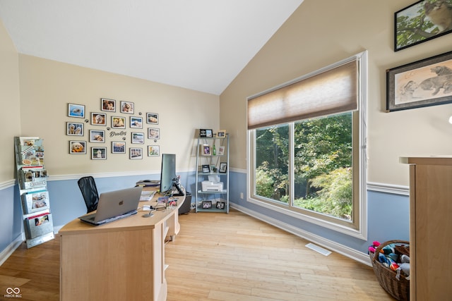 office area featuring light wood-type flooring and lofted ceiling