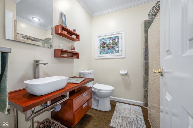 bathroom featuring vanity, a shower, crown molding, and toilet