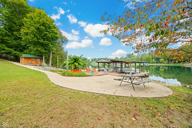 exterior space with a patio, a gazebo, a yard, and a water view