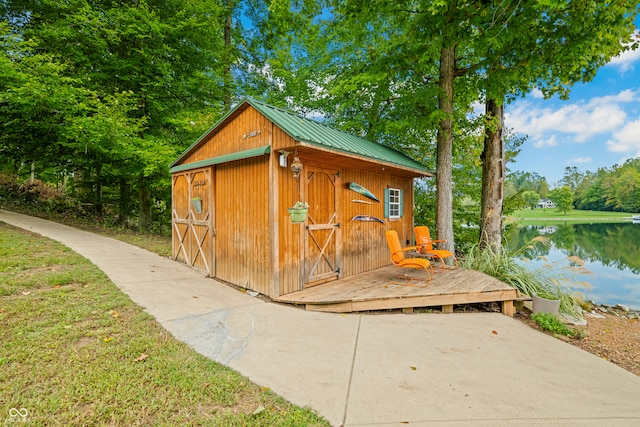 view of outbuilding with a water view