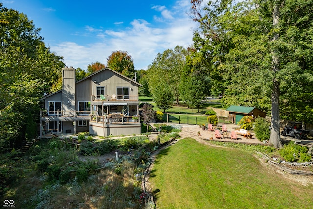 view of yard featuring a balcony and a patio area