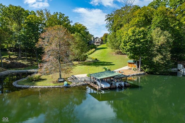 view of dock featuring a yard and a water view