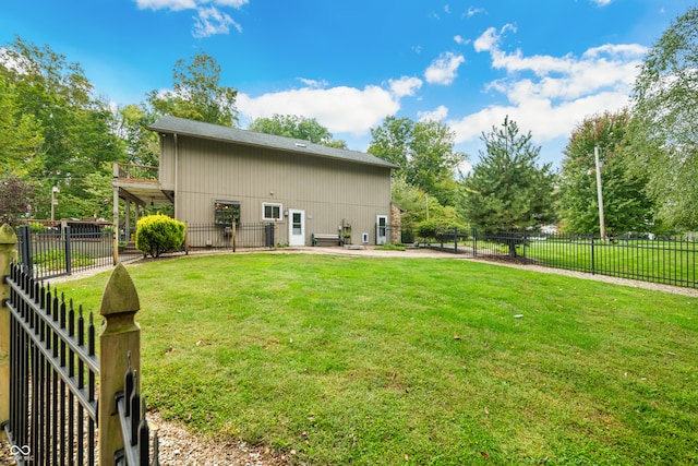 back of property with a patio and a yard