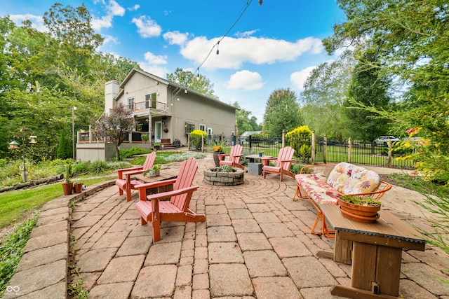 view of patio / terrace featuring an outdoor fire pit