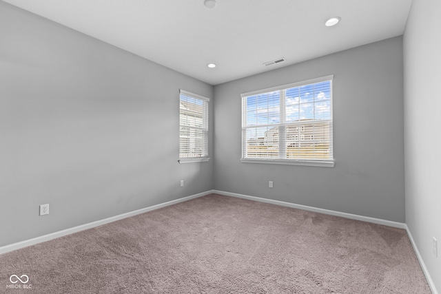 unfurnished room featuring carpet