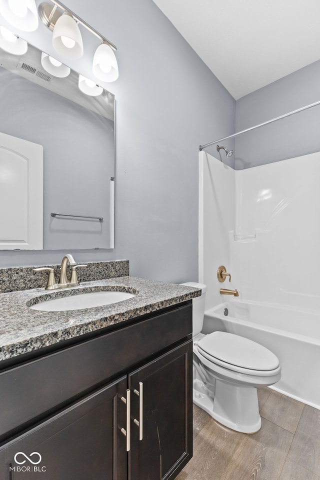 full bathroom featuring vanity, toilet, and shower / washtub combination