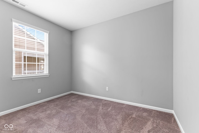 empty room with carpet flooring