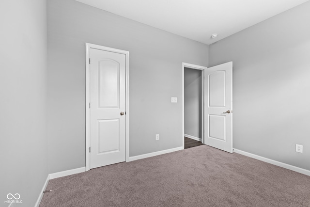 unfurnished bedroom featuring carpet flooring