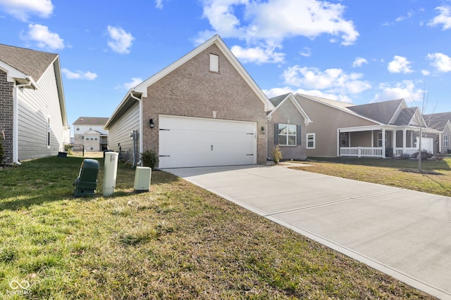 view of front of house featuring a front yard and a garage