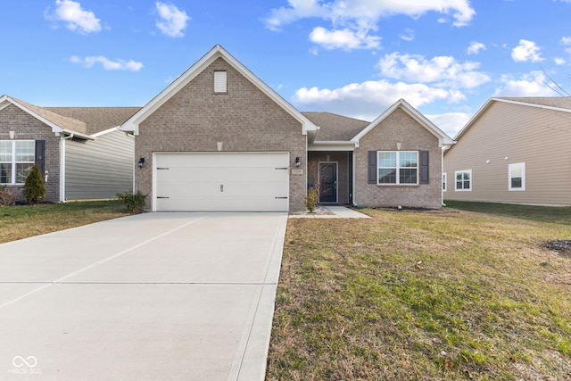 view of front of property featuring a garage and a front lawn