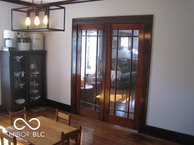 unfurnished dining area featuring dark hardwood / wood-style floors