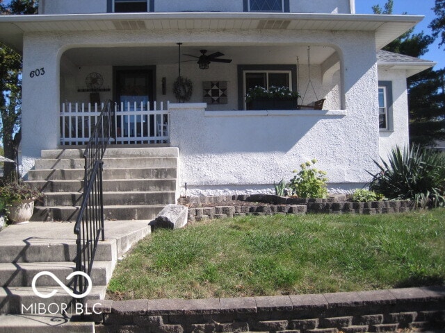 view of front of house with a porch and ceiling fan