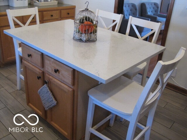 kitchen featuring a kitchen island and dark wood-type flooring