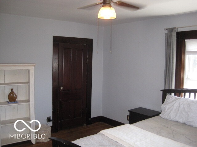 bedroom featuring dark hardwood / wood-style flooring