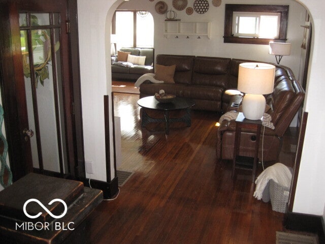 living room with dark wood-type flooring