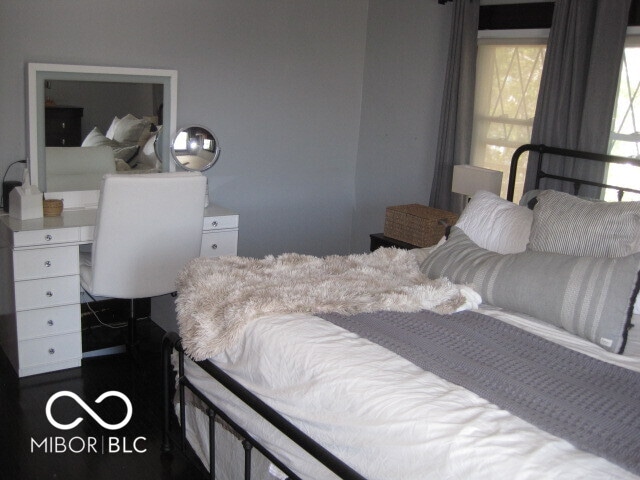 bedroom featuring dark hardwood / wood-style flooring