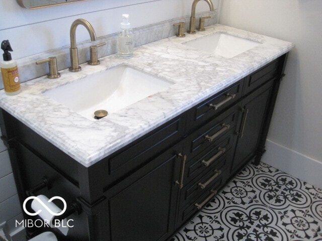 bathroom with tile patterned flooring and vanity