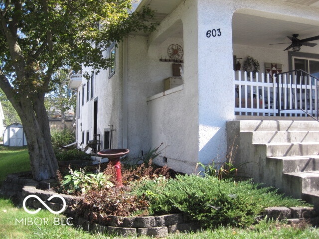 view of property exterior featuring ceiling fan