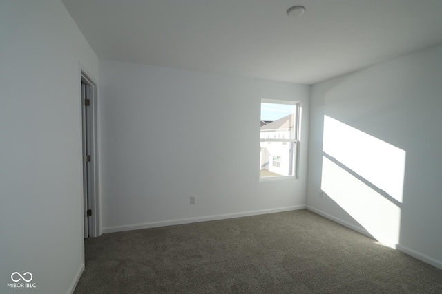 empty room with dark carpet