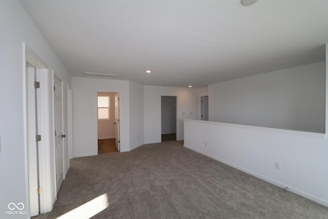 empty room featuring carpet flooring