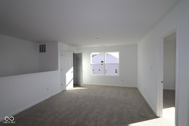 unfurnished room featuring carpet