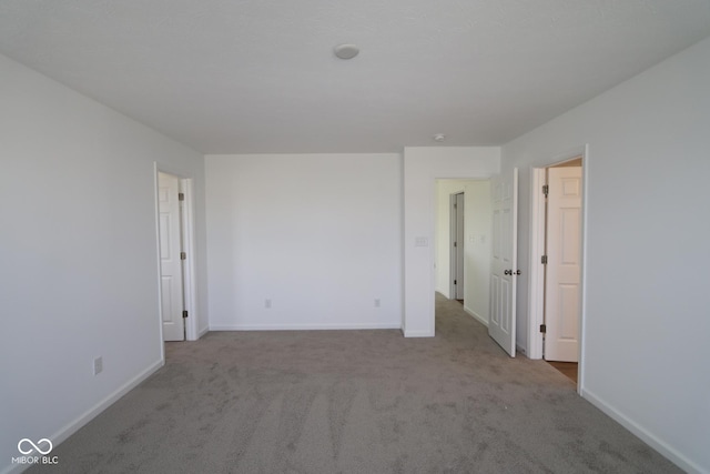 empty room with light colored carpet