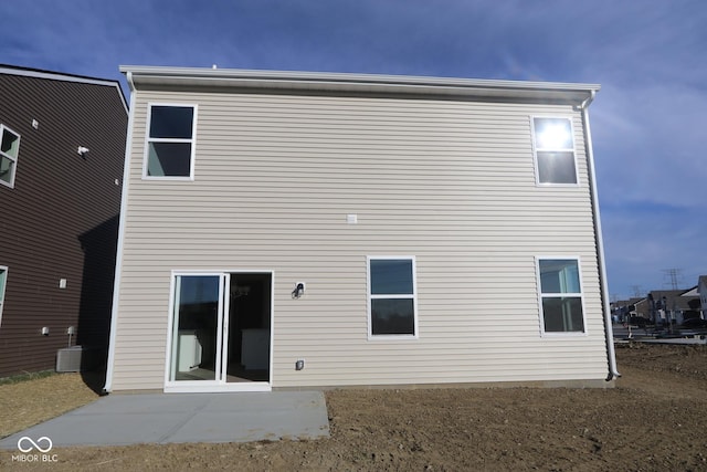 back of house with a patio and cooling unit