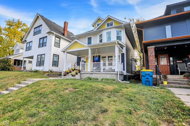 view of front of property with a front lawn and covered porch