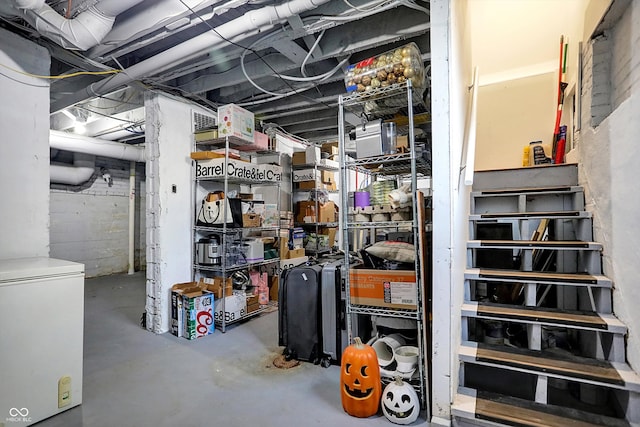 basement featuring refrigerator