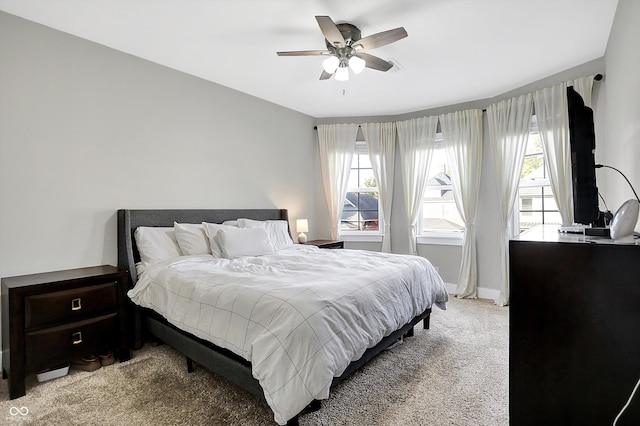 bedroom featuring ceiling fan and light colored carpet