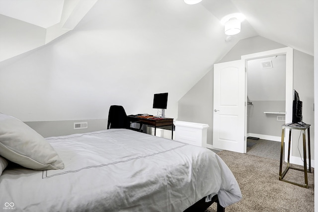 bedroom with light colored carpet and vaulted ceiling